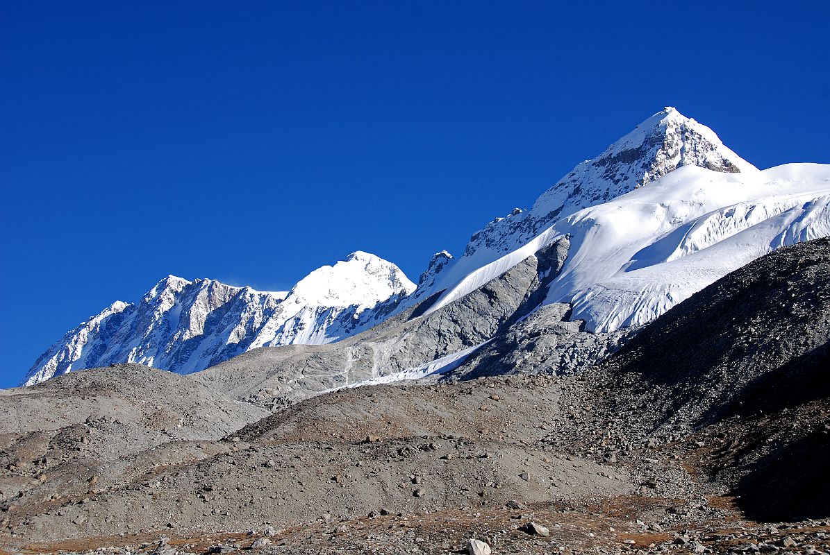 46 Shishapangma Southwest Face, Pungpa Ri And Nyanang Ri Early Morning From Shishapangma Southwest Advanced Base Camp Shishapangma (8012m) Southwest Face stretches to Pungpa Ri (7445m) and Nyanang Ri (7071m) in the early morning from Shishapangma Southwest Advanced Base Camp.